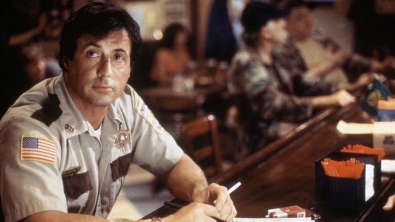Stallone bleeding and staring