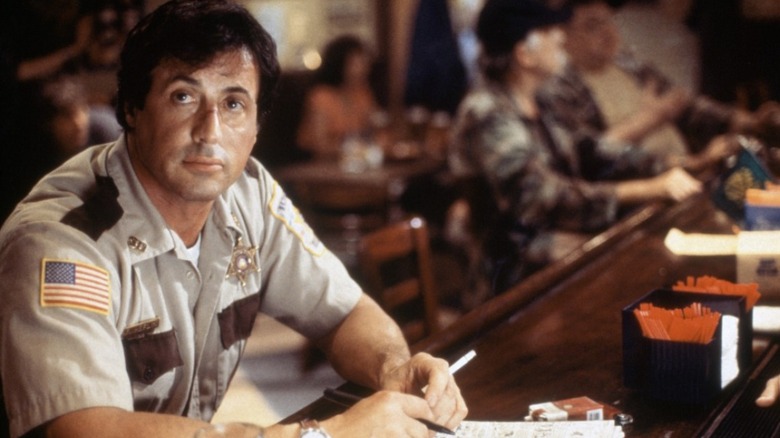 Stallone bleeding and staring