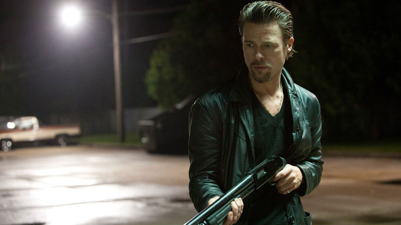 Brad Pitt holding a gun