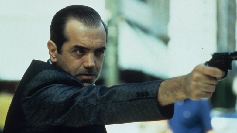 Castellano points a gun
