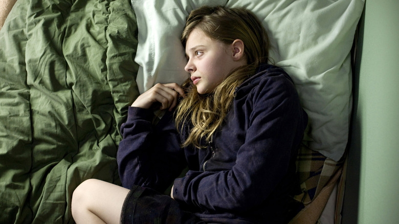 Abby laying in bed in Let Me In (2010)
