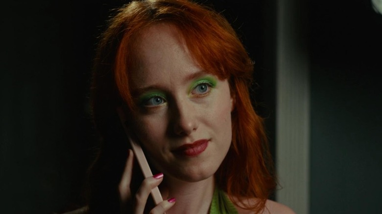 Ash on phone in Cannibal Mukbang (2023)