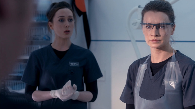 Doctors operate on a patient