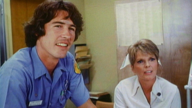 Officer Gage and nurse McCall at the situation desk