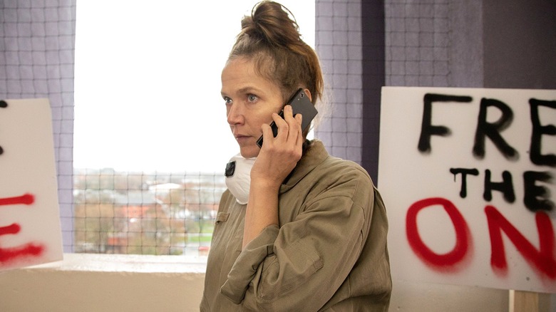 Edith Lyons listening to her phone in 