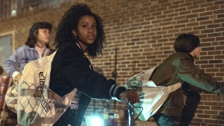 Erin Tieng, Tiff Quilkin, and Mac Coyle riding their bicycles in Paper Girls