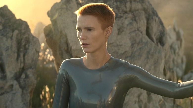 Mother standing by the rocks in Raised by Wolves