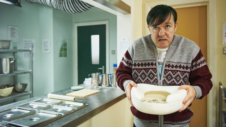 Derek carrying a bedpan