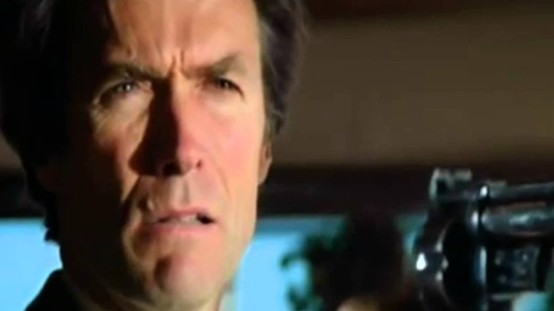 Clint Eastwood points pistol