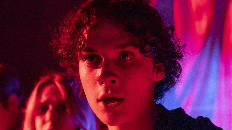 Randall in red light and background in 'Unhuman' still