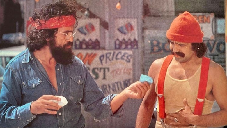 Chong hands Cheech some papers