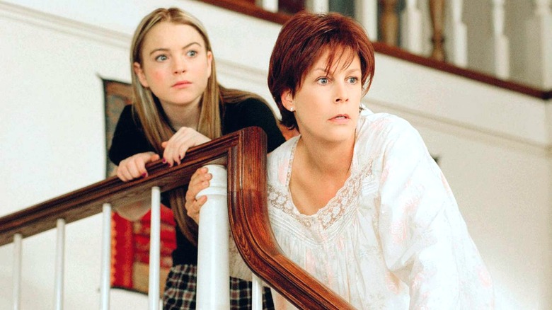 Tess and Anna holding stair railing