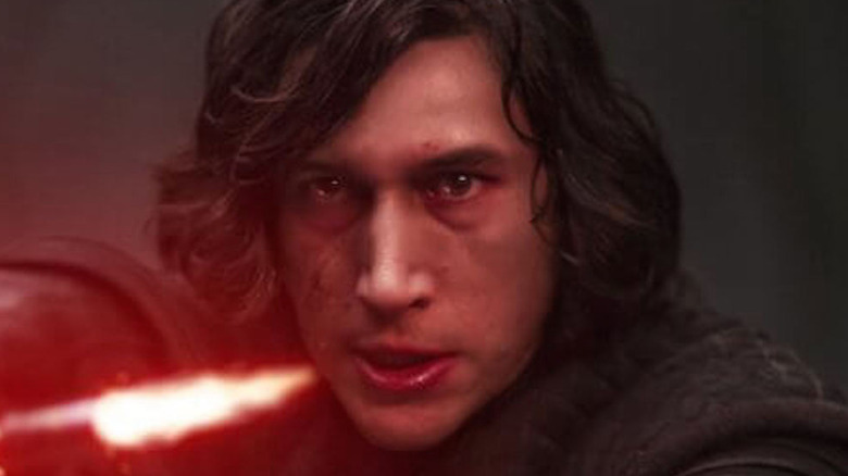 Kylo Ren pointing lightsaber