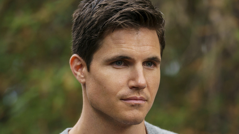 Robbie Amell as Nathan Upload Amazon
