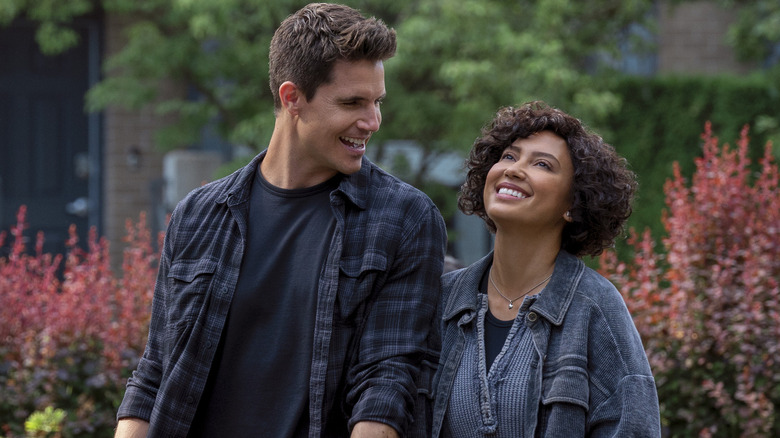 Robbie Amell and Andy Allo smiling