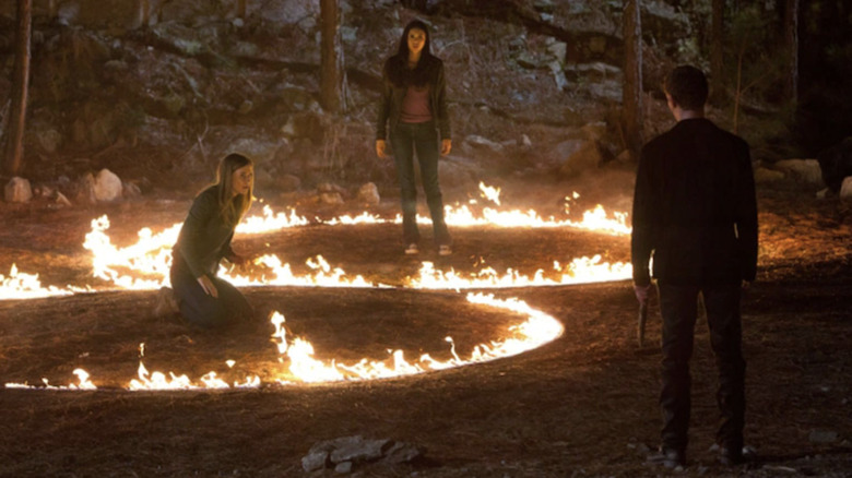 Elena and Jenna look at Klaus