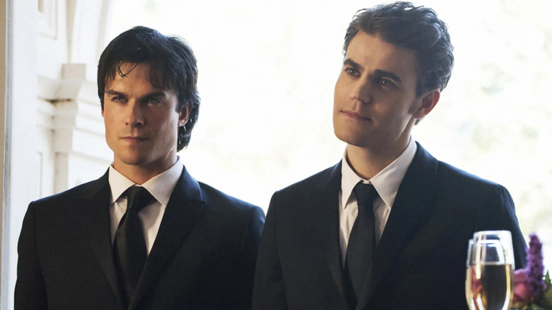 Stefan and Damon Salvatore wearing suits