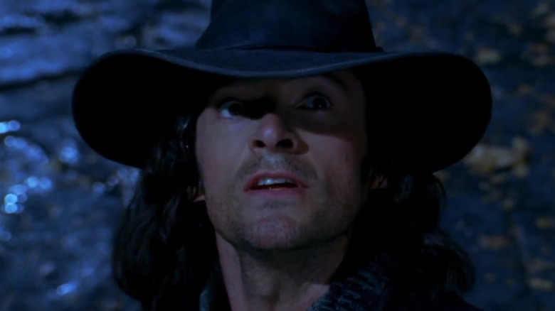 Hugh Jackman as Van Helsing wearing a floppy brimmed black hat