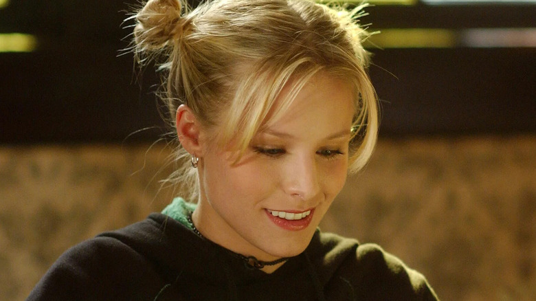 Veronica smiling at laptop space buns