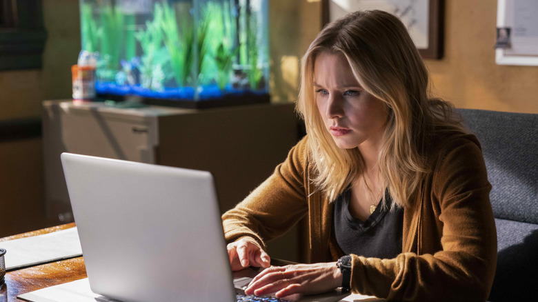 Adult Veronica at laptop