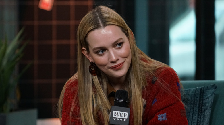 Pedretti sits at microphone