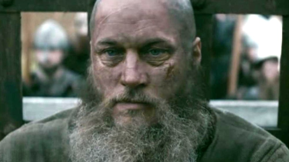 Travis Fimmel as a bearded Ragnar staring intently on Vikings