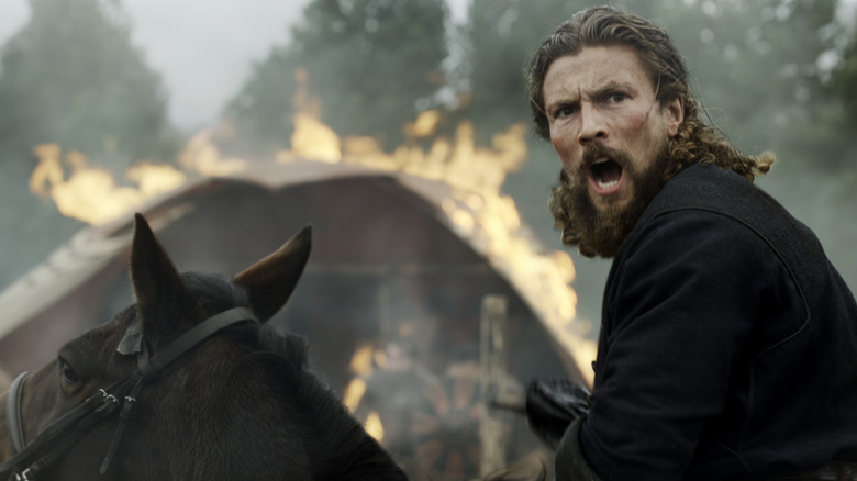 Harald yelling on horse next to fire