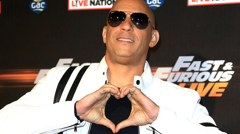 Vin Diesel making a heart gesture for the camera
