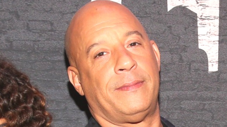 Vin Diesel smirking in press photo