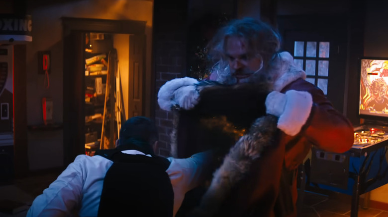 Santa Claus blocks a punch with his magic bag in Violent Night