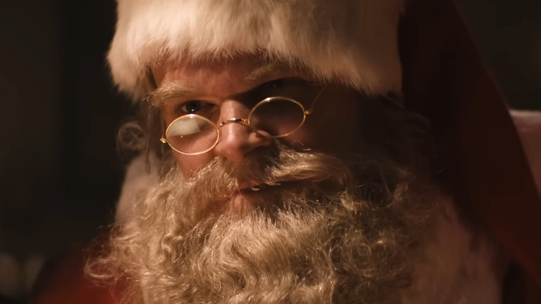 David Harbour drinking at a bar as Santa