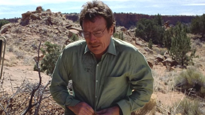 Walter White putting on a shirt over his tighty-whiteys