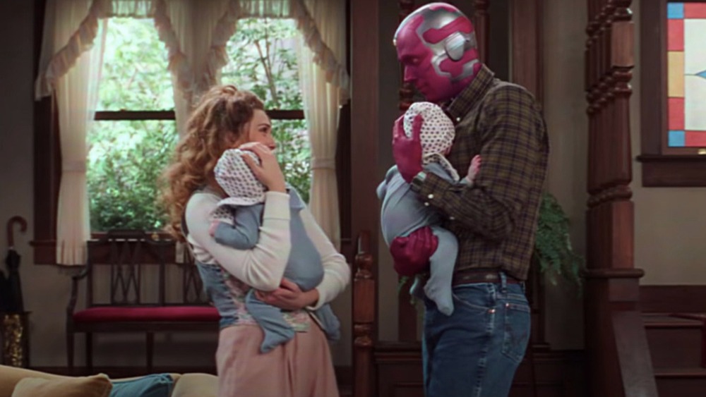 Wanda and Vision holding Billy and Tommy