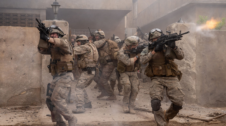Soldiers walk onto the street shooting in 
