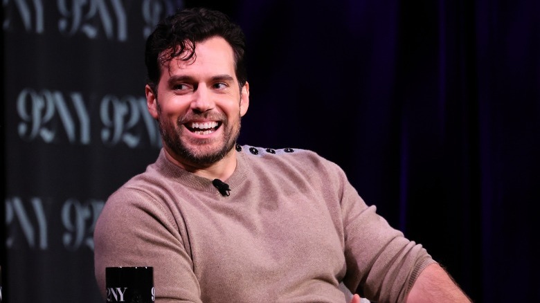 Henry Cavill laughing and talking on stage