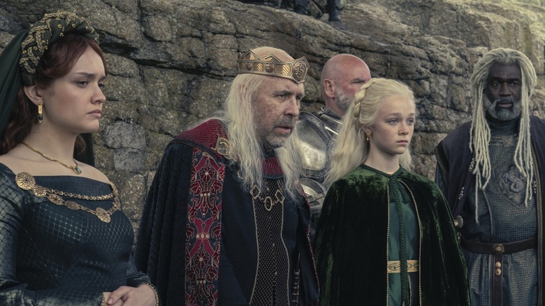 Viserys, Alicent and others staring ahead