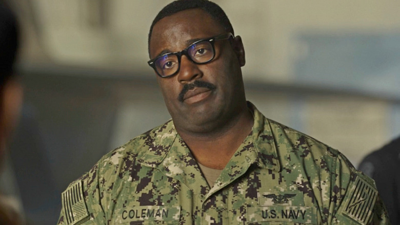 Hondo wears a Navy uniform