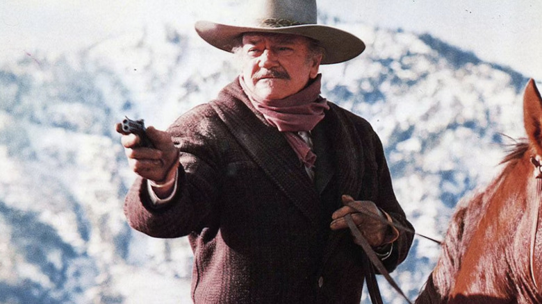 J.B. Books fires on his opponents in The Shootist (1976)
