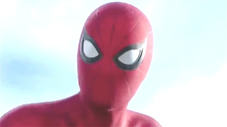 Spider-Man holding his head