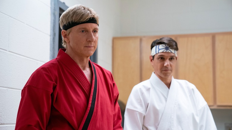 William Zabka and Ralph Macchio looking off camera in Cobra Kai