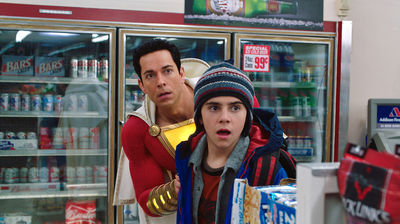 Shazam and Freddy Freeman taking cover in Shazam! (2019)