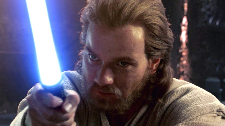 Ewan McGregor wields a lightsaber