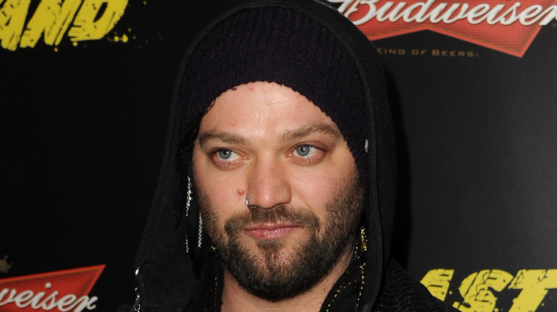 Bam Margera looks to the side