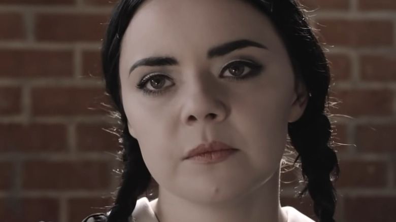 Wednesday Addams answering the phone