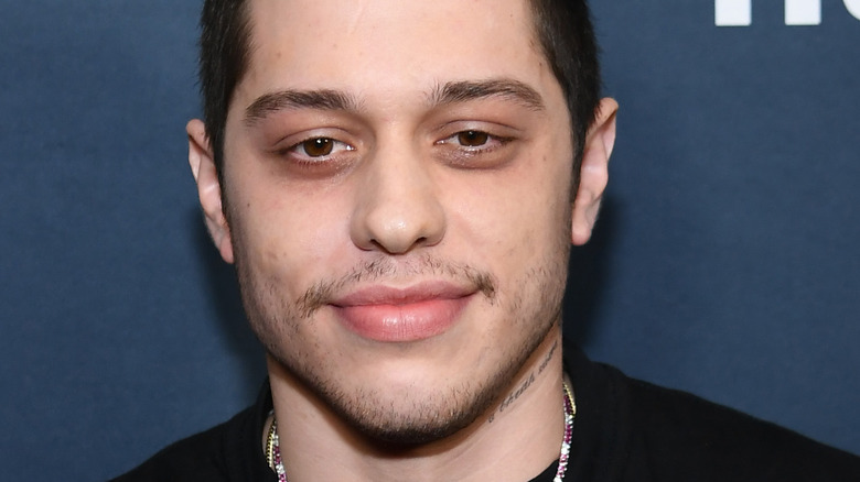 Pete Davidson smiles