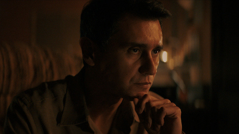 Manousos Oviedo pondering in Pluribus