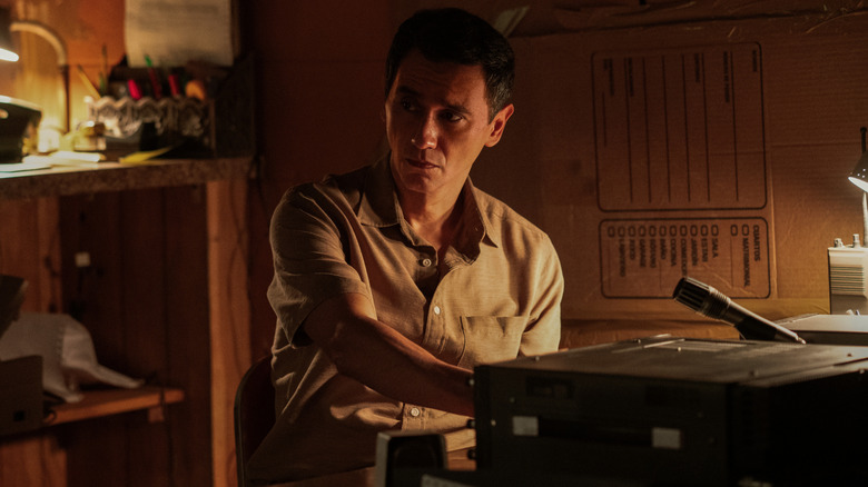 Manousos checking the radio on Pluribus