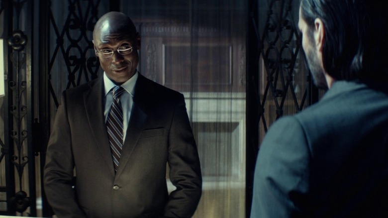Charon smiles at John in "John Wick" (2014)
