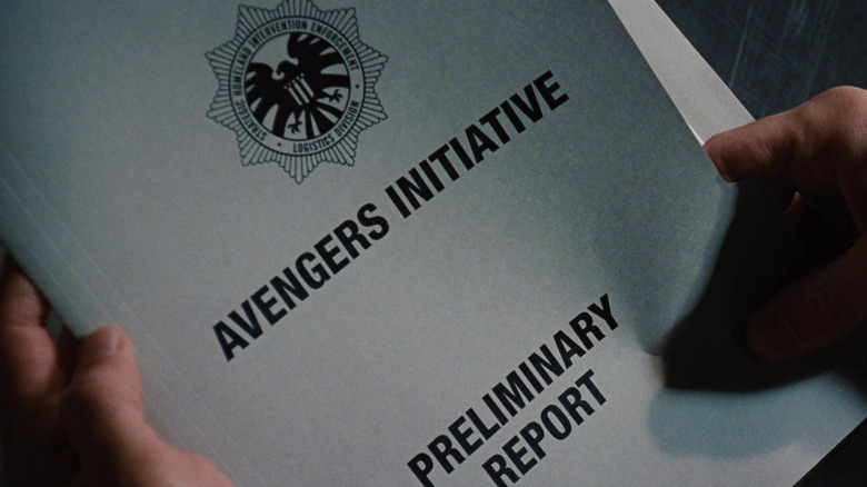Tony Stark holding copy of Avengers Initiative in Iron Man 2
