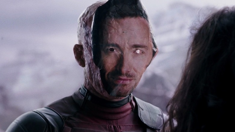 Deadpool wearing Hugh Jackman mask